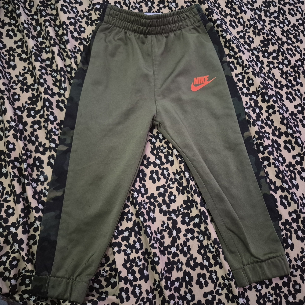 Nike Kids Green Joggers with Orange Logo